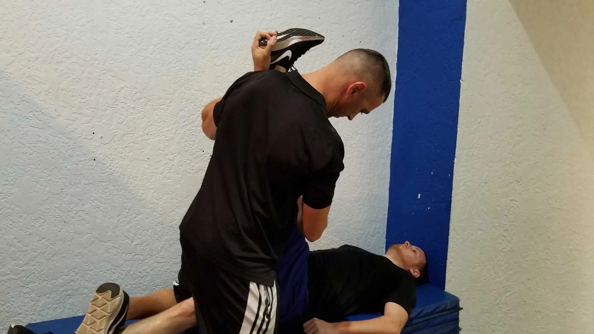 Personal Trainer, Francois Tort stretching a client to increase flexibility in Ruskin, FL.