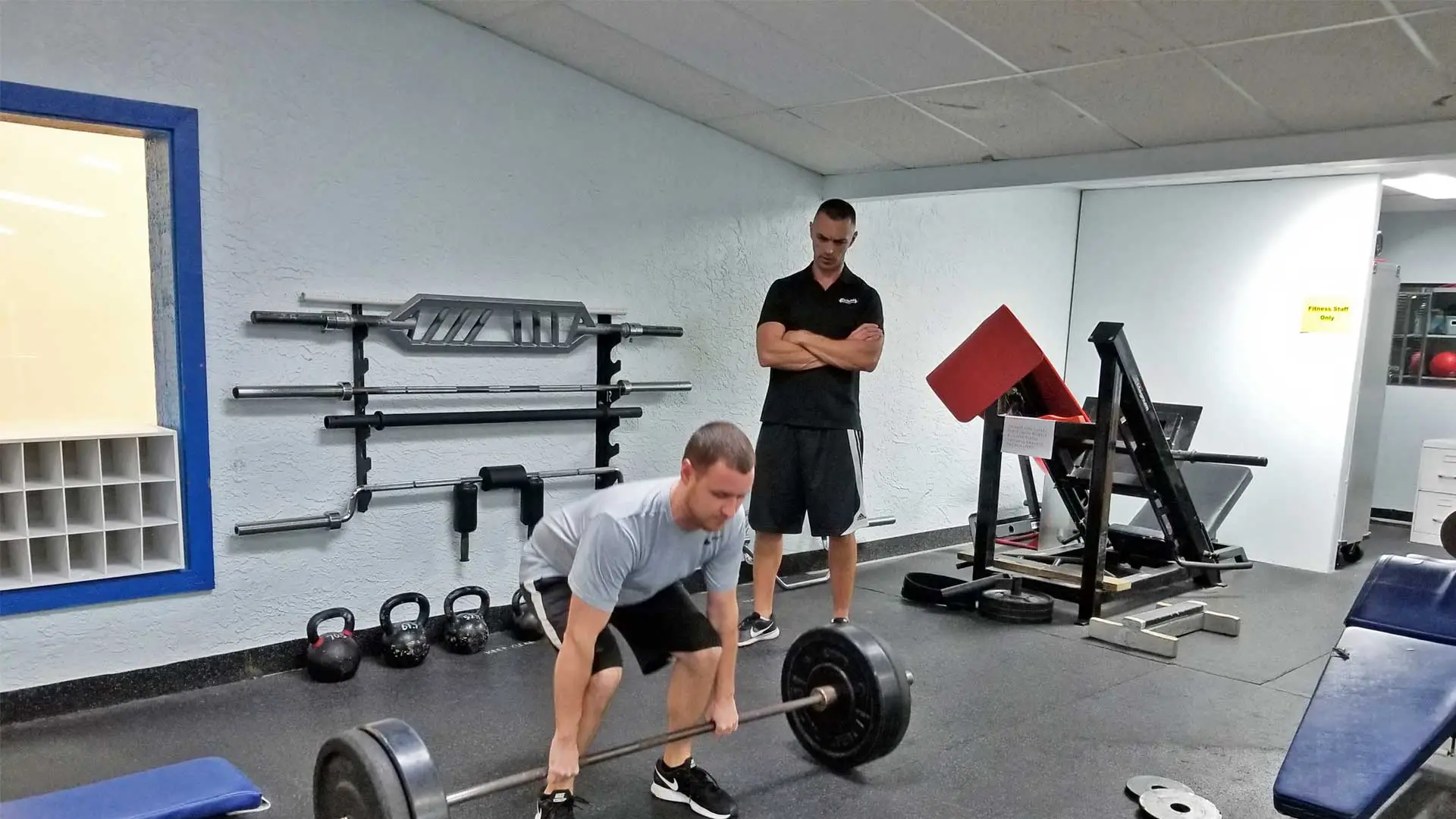 Francois founder of FastTwitch Fitness Performance training a client on how to do a proper dead lift in Apollo Beach