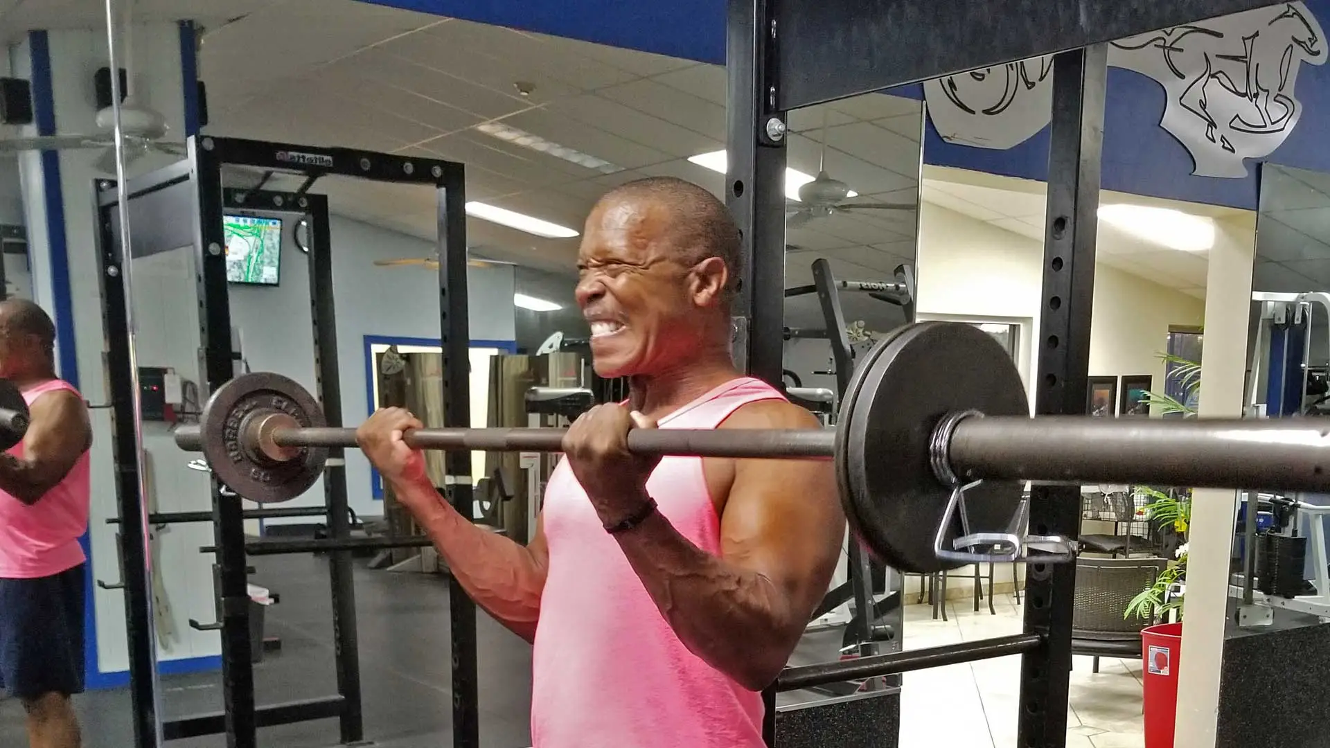 Personal training for muscle building, client working on his biceps in Apollo Beach, FL.