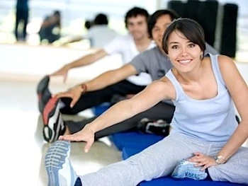 Personal training clients stretching in the gym in Apollo Beach, FL.