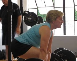 Mature Athlete/ Senior dead lift at an Apollo Beach gym.