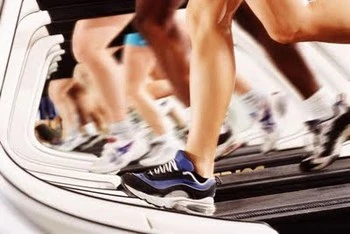 Gym clients working out on a treadmill in Apollo Beach, FL.