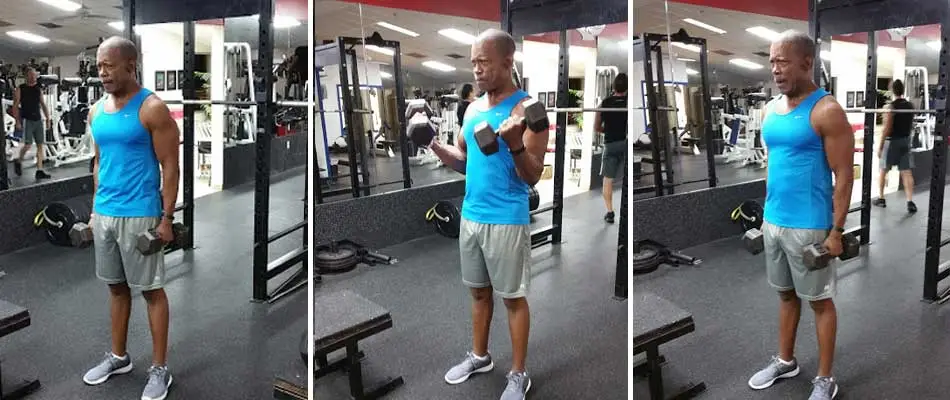 Muscular man at the gym in Apollo Beach doing curls!