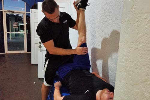 Apollo Beach, FL client working on flexibility with a personal trainer.